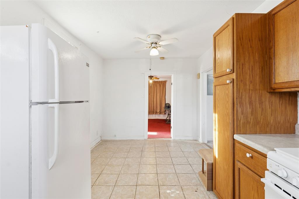 1602 Bruce Drive Garland, TX 75043 - Photo 12 of 31 a kitchen with stainless steel appliances granite countertop a refrigerator and a sink