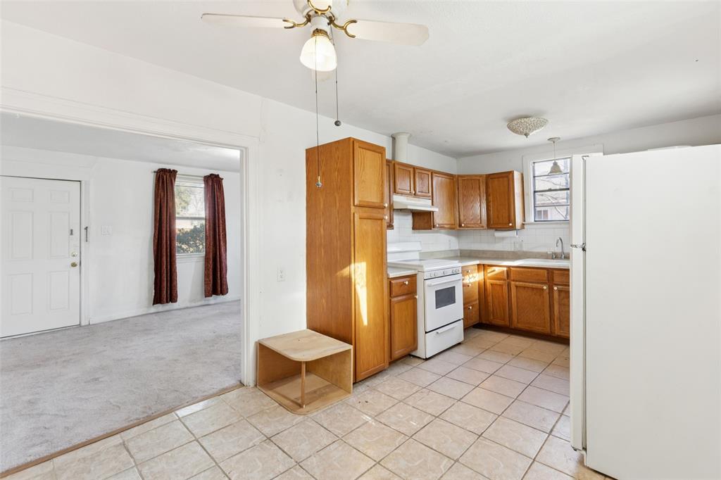 1602 Bruce Drive Garland, TX 75043 - Photo 15 of 31 a kitchen with stainless steel appliances granite countertop a sink and cabinets
