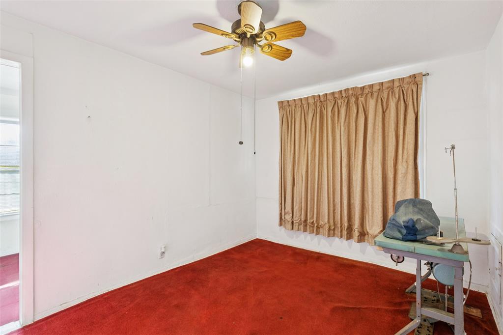 1602 Bruce Drive Garland, TX 75043 - Photo 16 of 31 a bedroom with a bed and a window