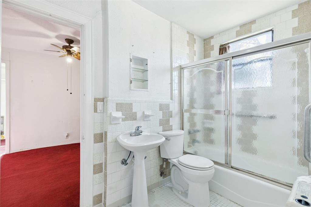 1602 Bruce Drive Garland, TX 75043 - Photo 19 of 31 a bathroom with a sink toilet and shower