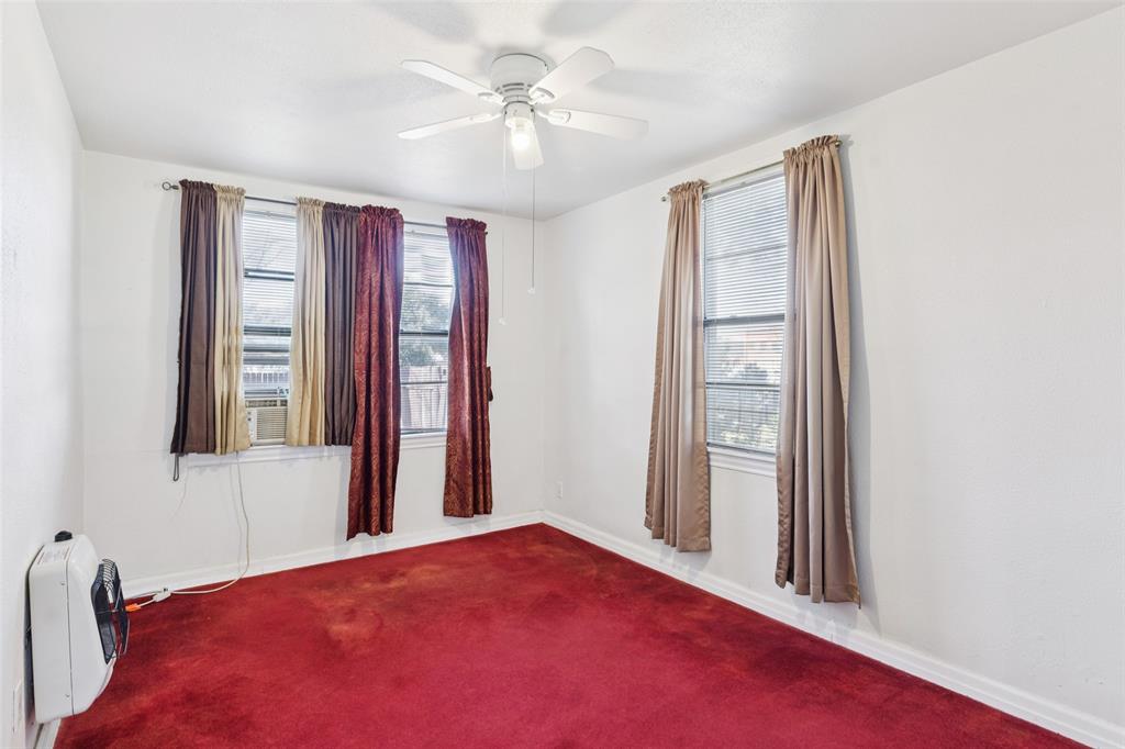 1602 Bruce Drive Garland, TX 75043 - Photo 20 of 31 a bedroom with a bed and a window