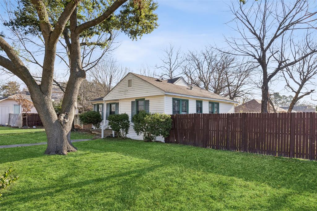 1602 Bruce Drive Garland, TX 75043 - Photo 2 of 31 a front view of a house with yard and green space