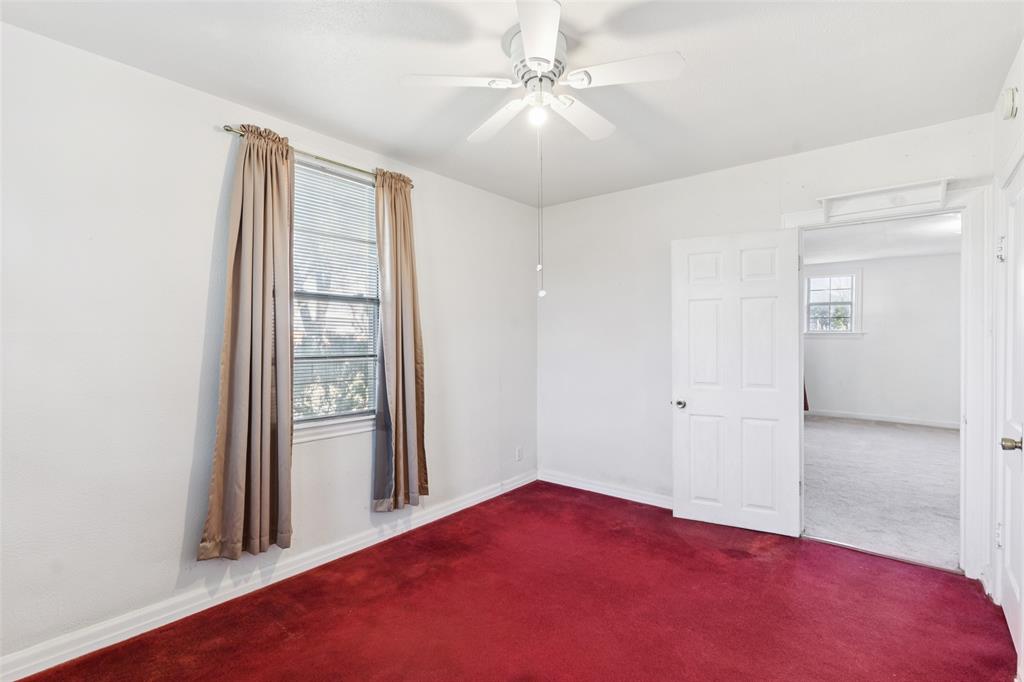 1602 Bruce Drive Garland, TX 75043 - Photo 22 of 31 an empty room with windows and closet