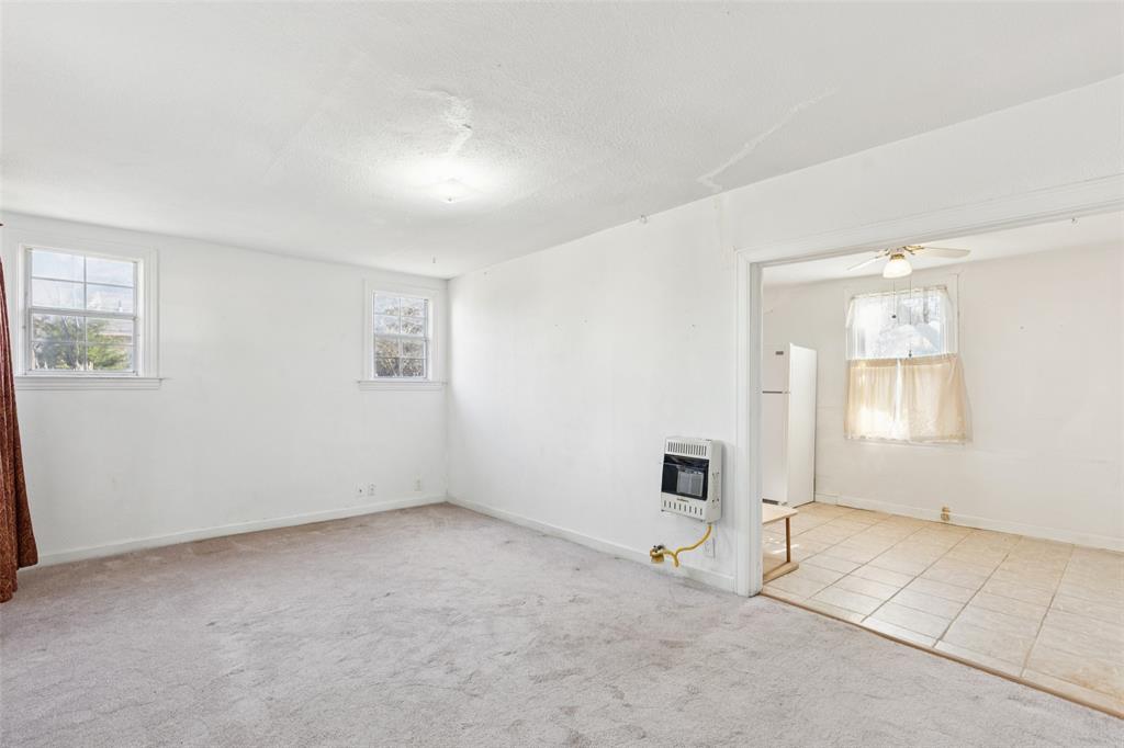1602 Bruce Drive Garland, TX 75043 - Photo 4 of 31 an empty room with windows