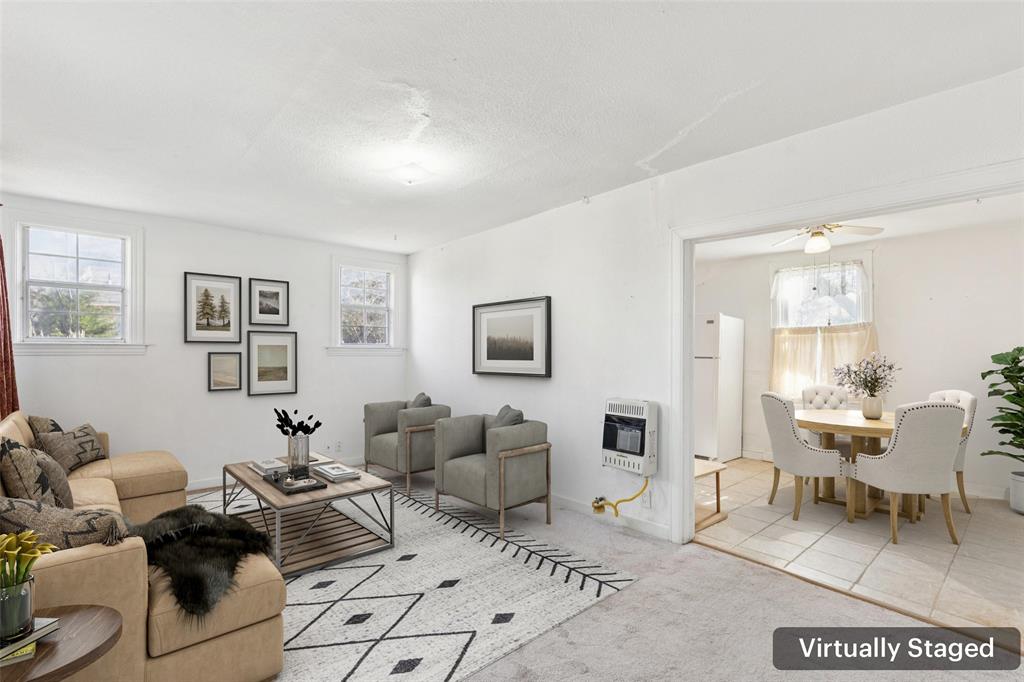 1602 Bruce Drive Garland, TX 75043 - Photo 5 of 31 a living room with furniture a rug and a window