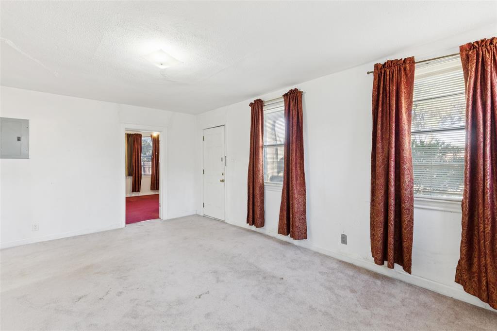 1602 Bruce Drive Garland, TX 75043 - Photo 6 of 31 an empty room with windows
