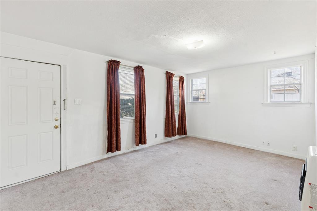 1602 Bruce Drive Garland, TX 75043 - Photo 8 of 31 an empty room with windows