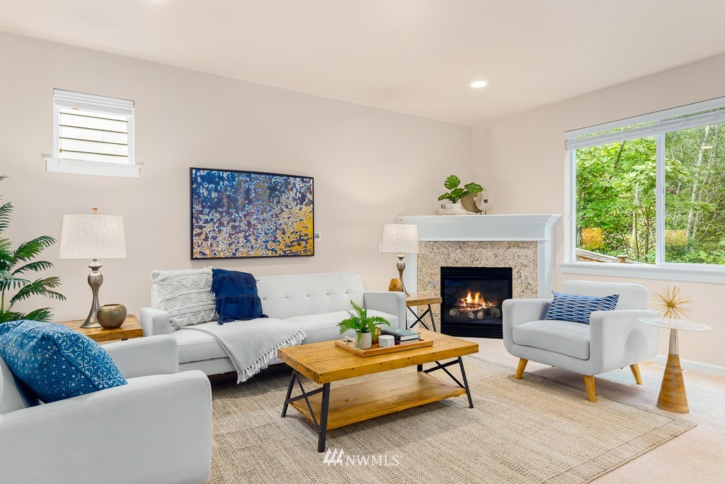 22511 38th Avenue Southeast Bothell, WA 98021 - Photo 4 of 29 a living room with furniture and a fireplace