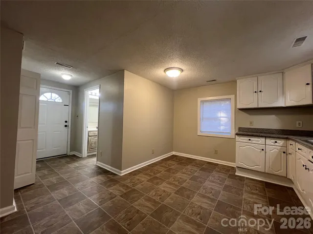 a view of a kitchen with electric appliances