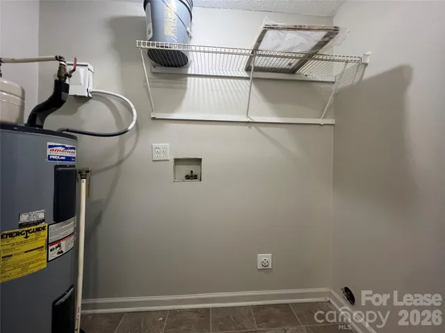 a view of storage and utility room with racks on the wall