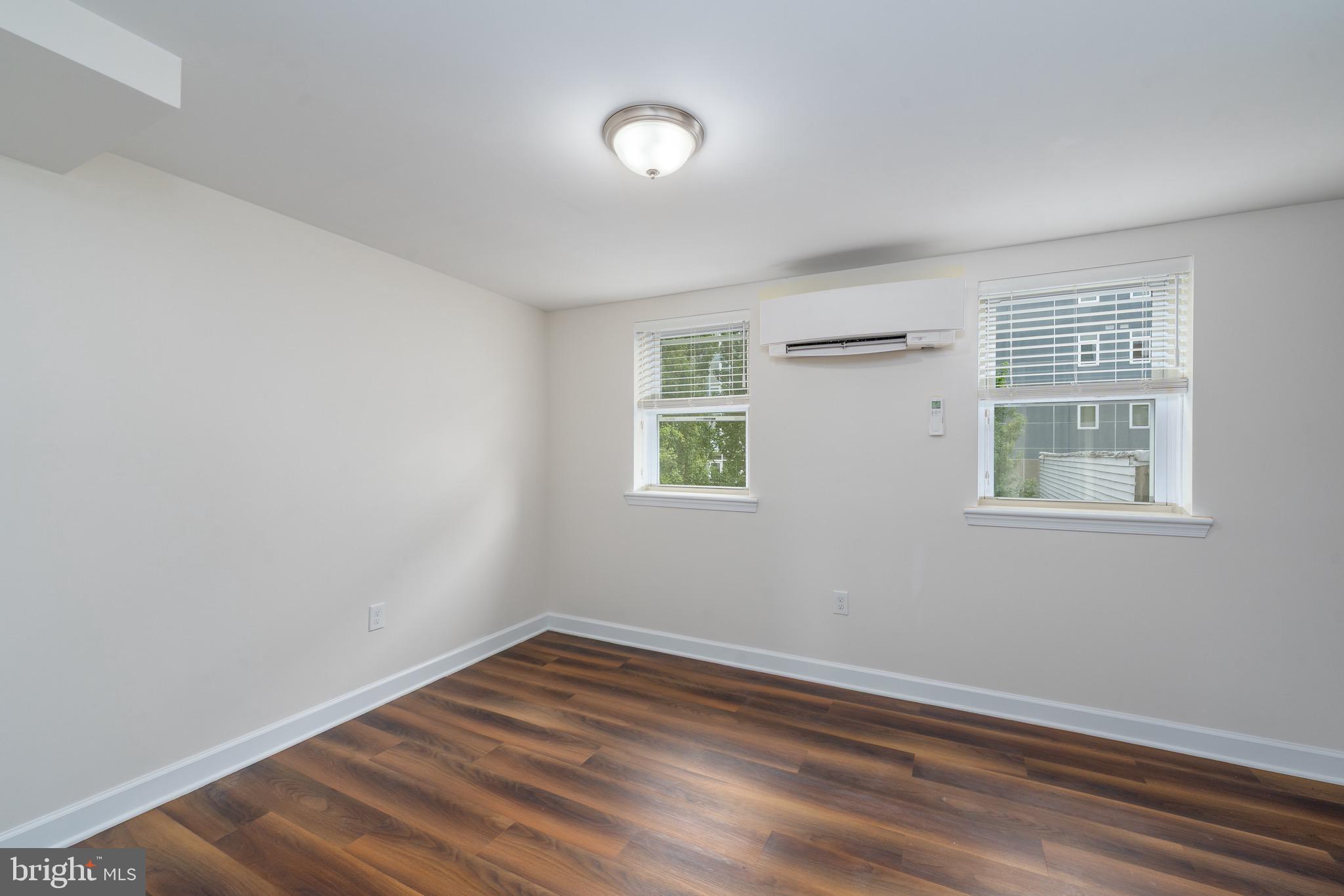 123 East Cross Street Baltimore, MD 21230 - Photo 17 of 33 an empty room with wooden floor and windows