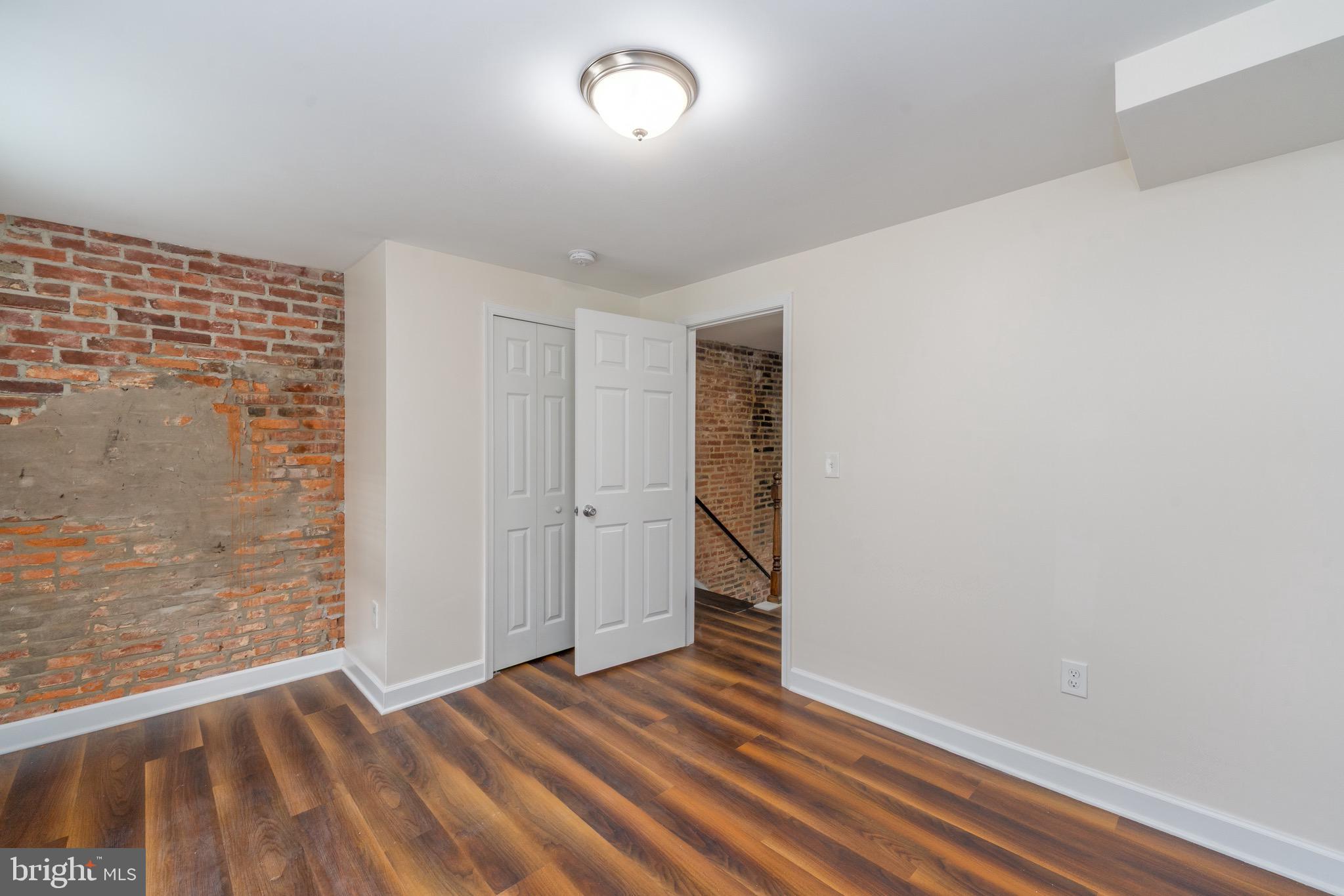 123 East Cross Street Baltimore, MD 21230 - Photo 18 of 33 a view of an empty room with wooden floor
