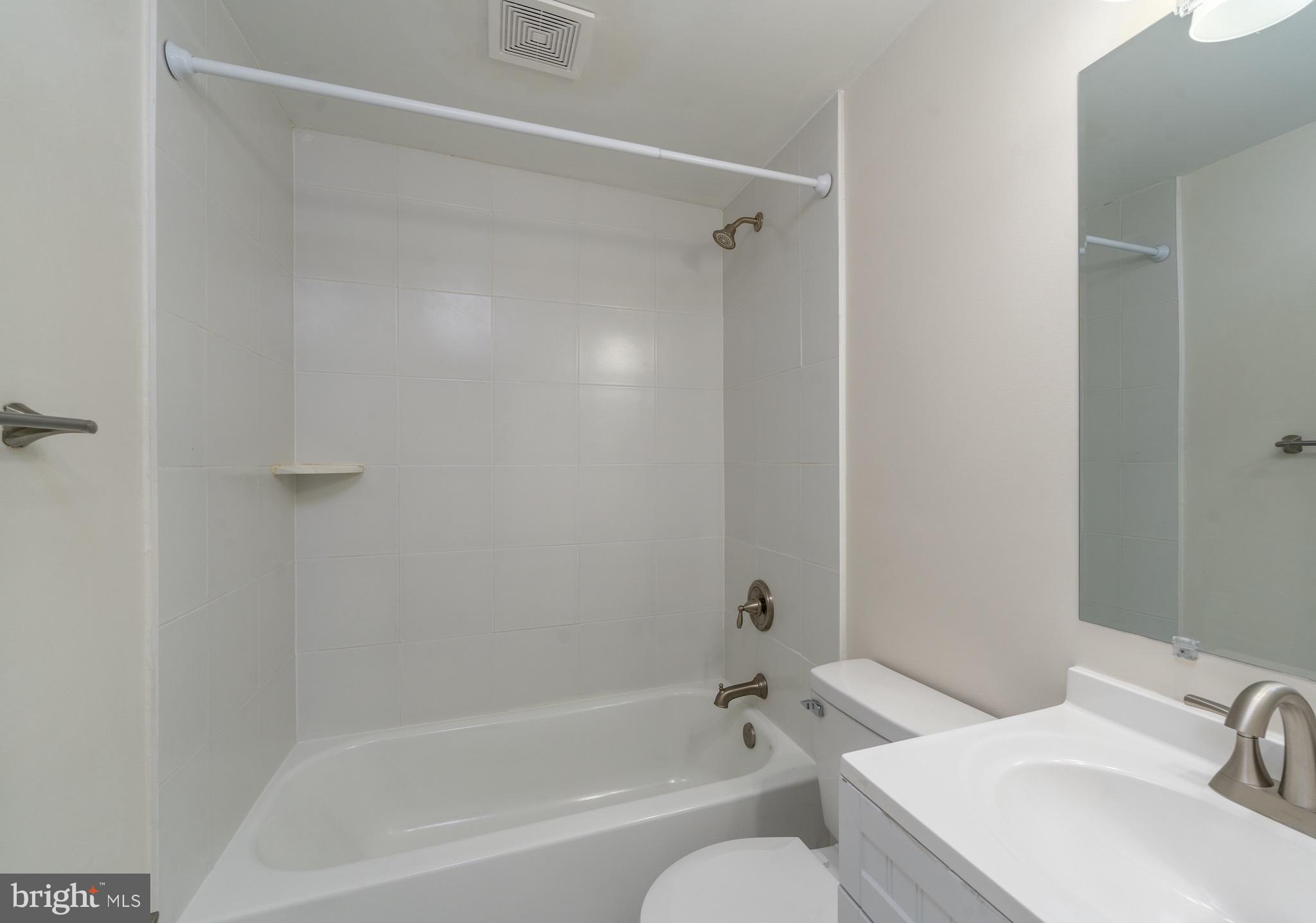 123 East Cross Street Baltimore, MD 21230 - Photo 28 of 33 a bathroom with a sink and a mirror