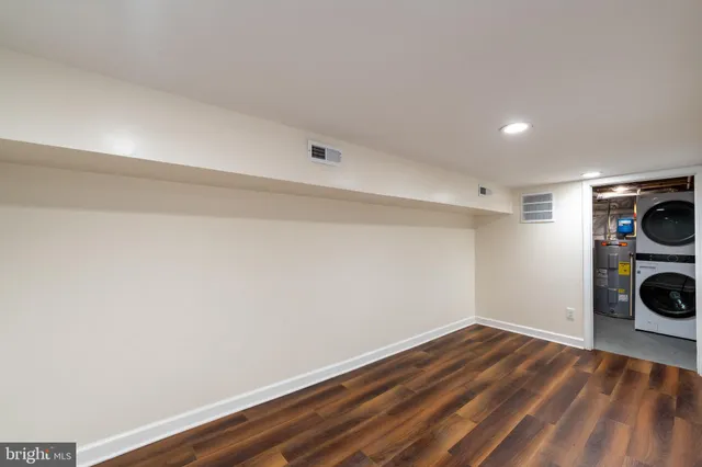 a view of a storage & utility room with wooden floor