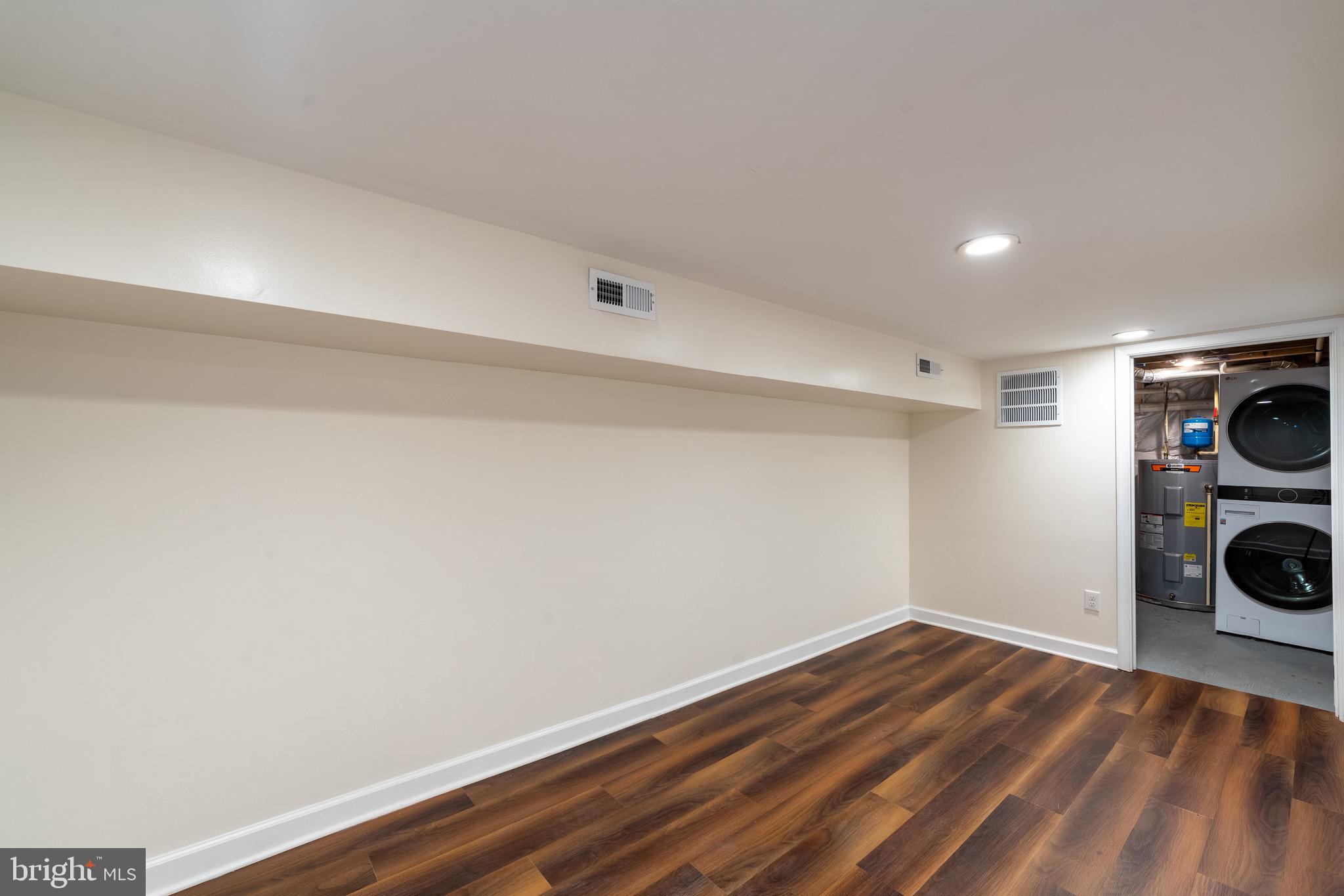 123 East Cross Street Baltimore, MD 21230 - Photo 32 of 33 a view of a storage & utility room with wooden floor