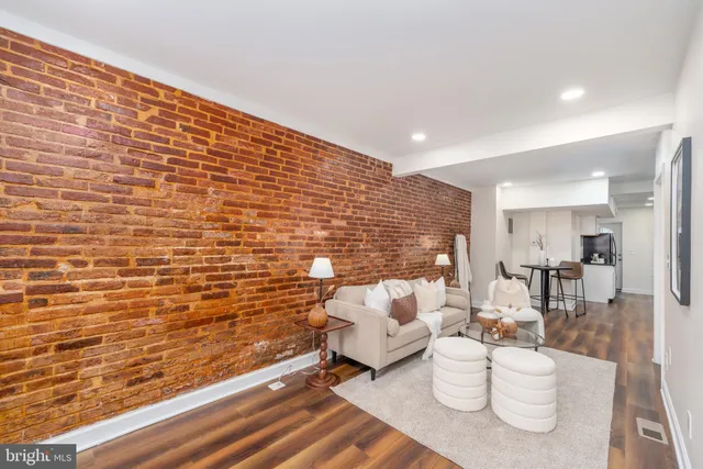 a living room with furniture and a table