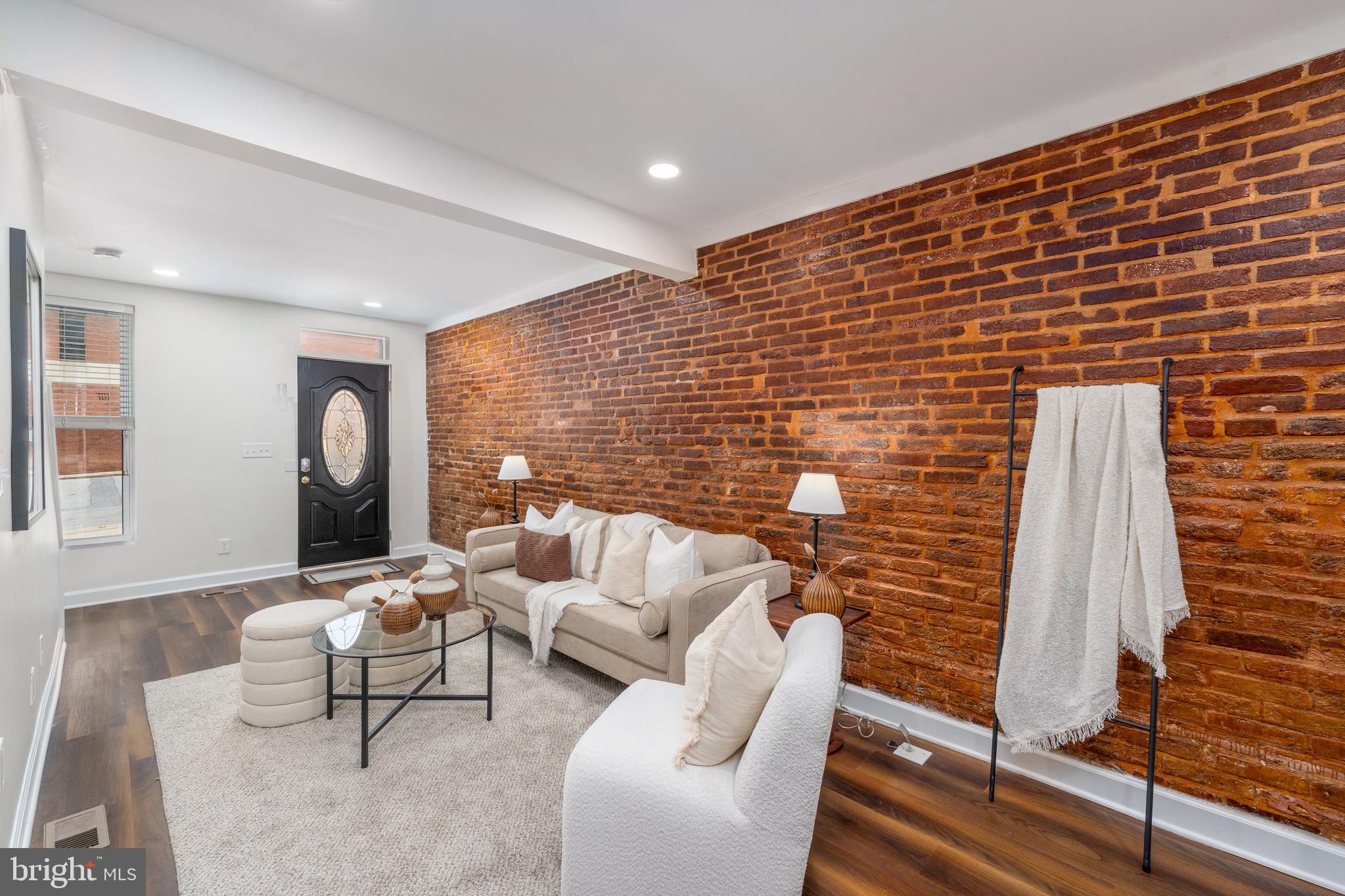 123 East Cross Street Baltimore, MD 21230 - Photo 6 of 33 a living room with furniture and a fireplace