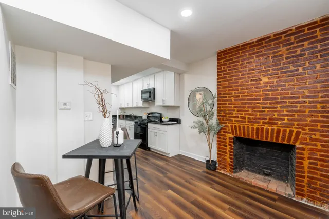 a dining room with furniture and a fireplace