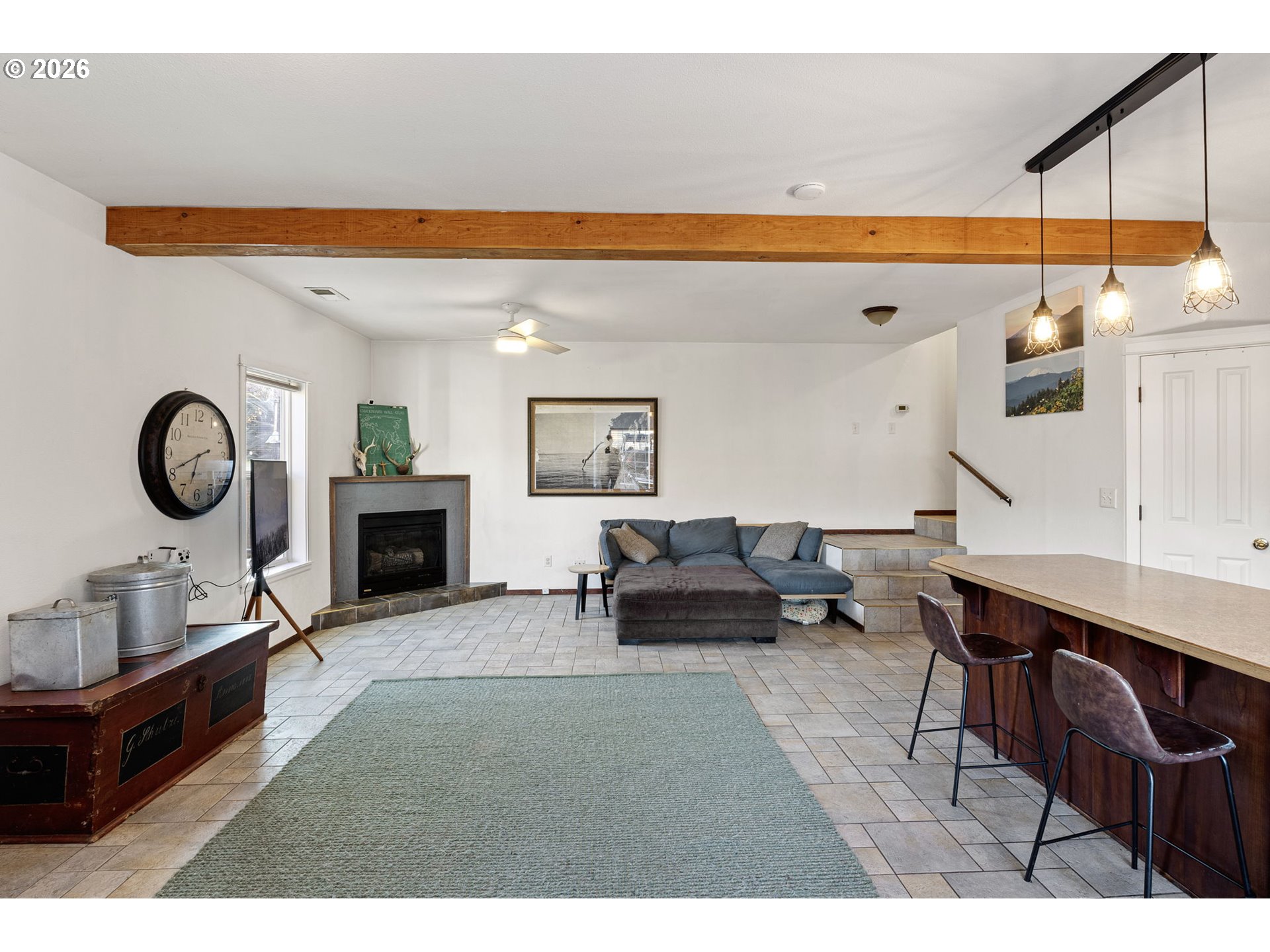 777 Oak Street Oakland, OR 97462 - Photo 12 of 45 a living room with furniture a rug and a fireplace