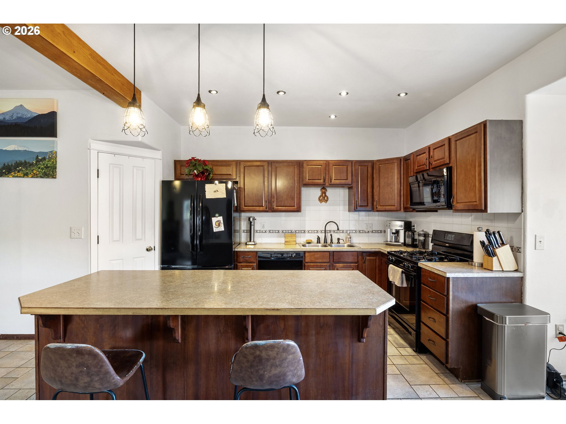 777 Oak Street Oakland, OR 97462 - Photo 16 of 45 a kitchen with stainless steel appliances a sink stove and refrigerator