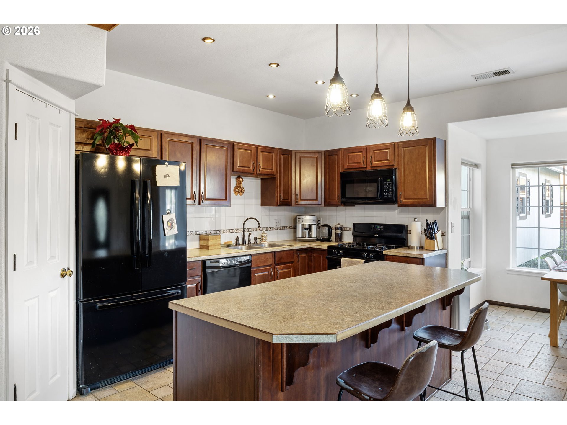 777 Oak Street Oakland, OR 97462 - Photo 17 of 45 a kitchen with cabinets and stainless steel appliances
