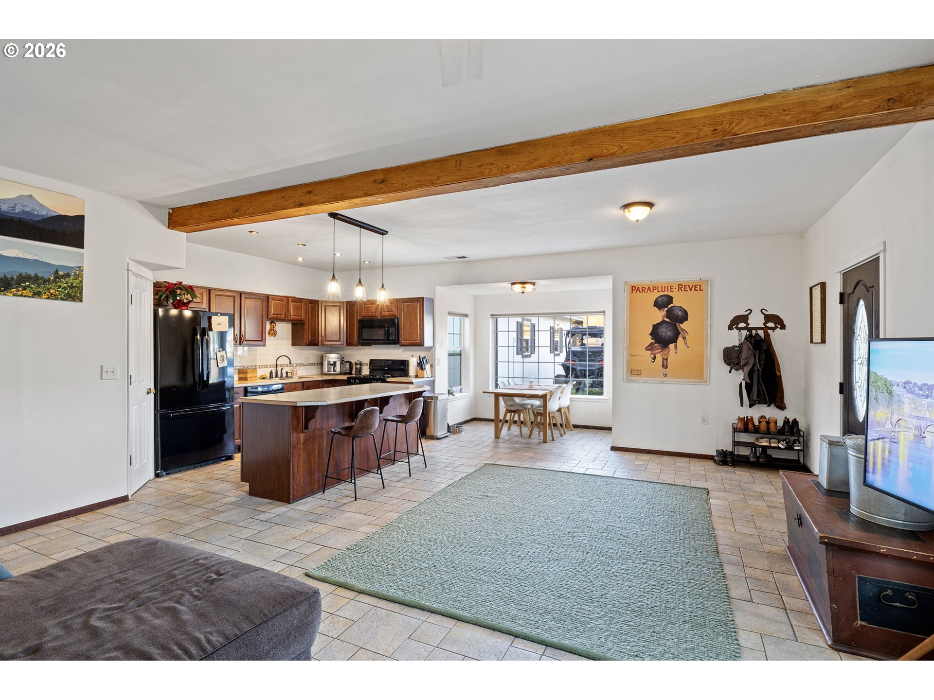777 Oak Street Oakland, OR 97462 - Photo 21 of 45 a living room with stainless steel appliances kitchen island granite countertop furniture and a kitchen view