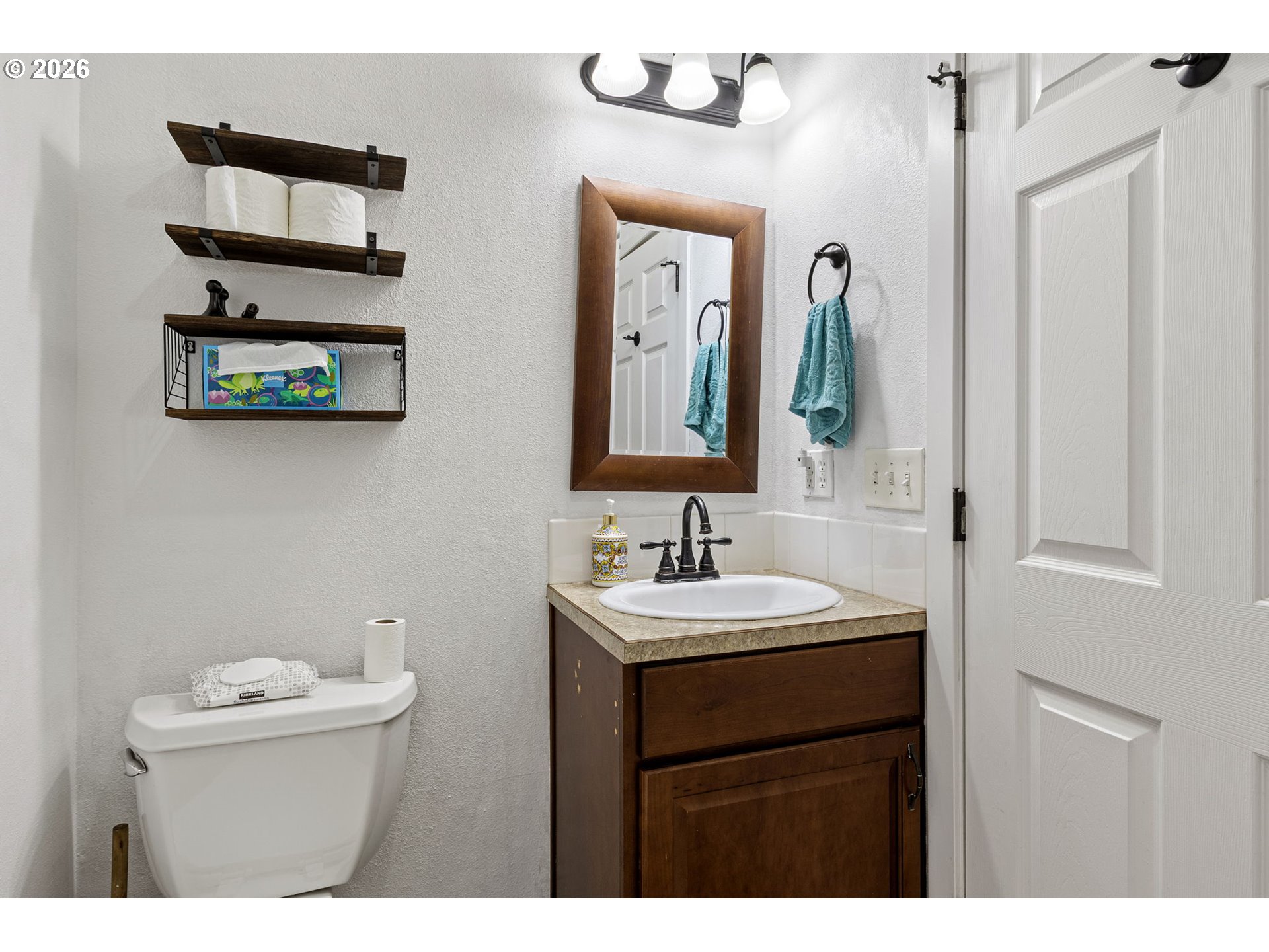 777 Oak Street Oakland, OR 97462 - Photo 26 of 45 a bathroom with a toilet sink and mirror