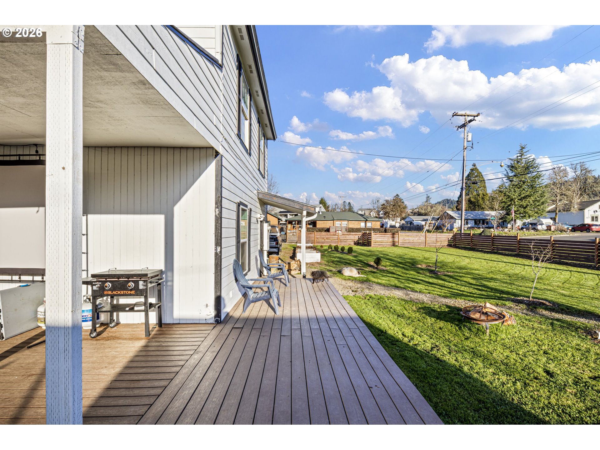777 Oak Street Oakland, OR 97462 - Photo 32 of 45 a view of a swimming pool outdoor seating and wooden floor