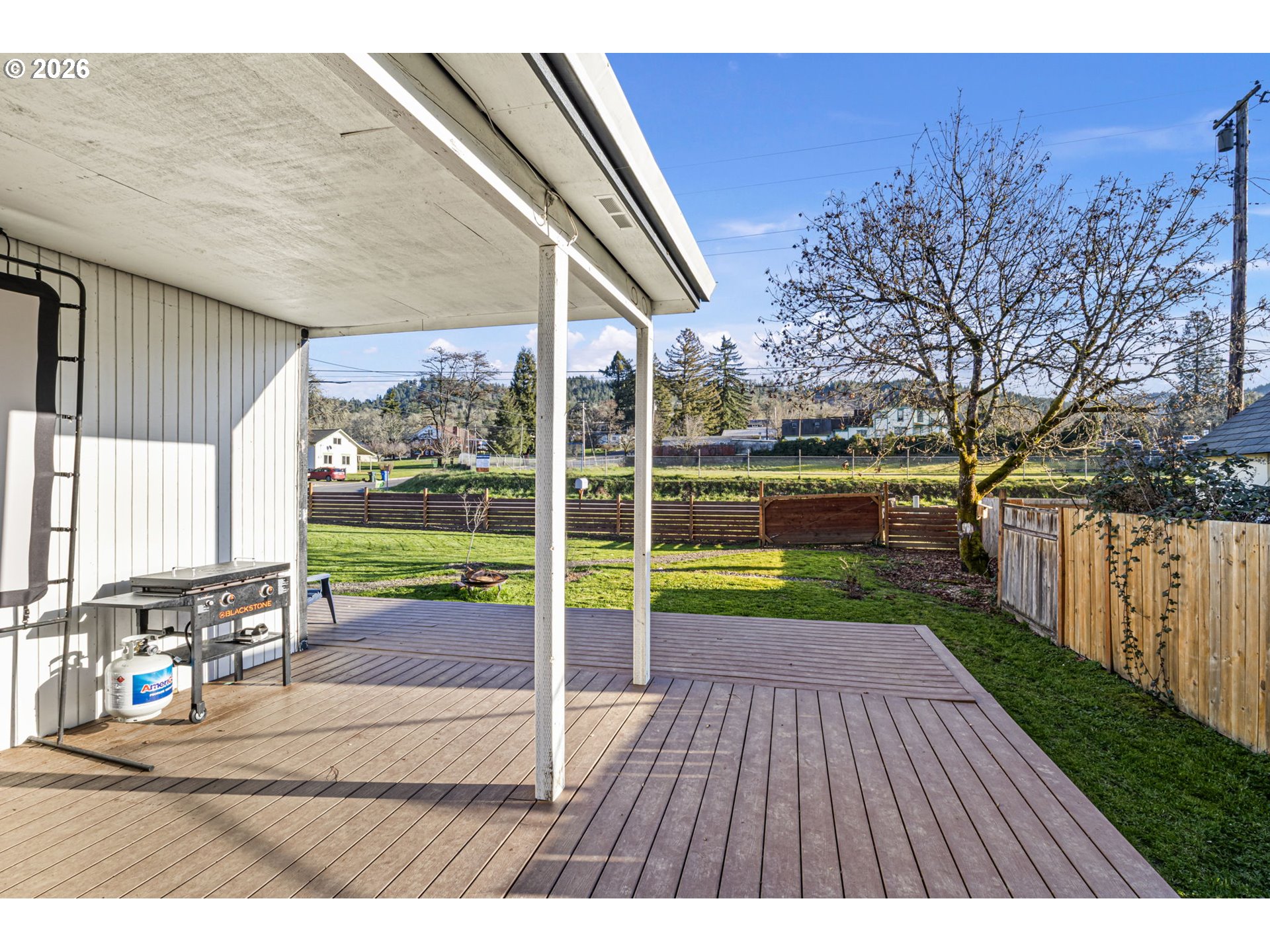777 Oak Street Oakland, OR 97462 - Photo 34 of 45 a view of a porch with wooden floor and fence