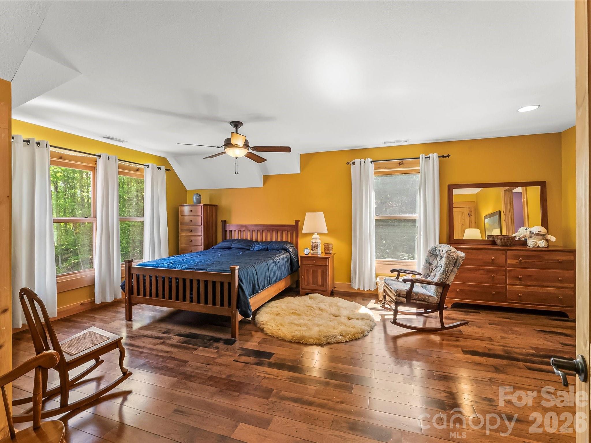 917 Otter Mountain Road Topton, NC 28781 - Photo 33 of 48 a bedroom with furniture and wooden floor