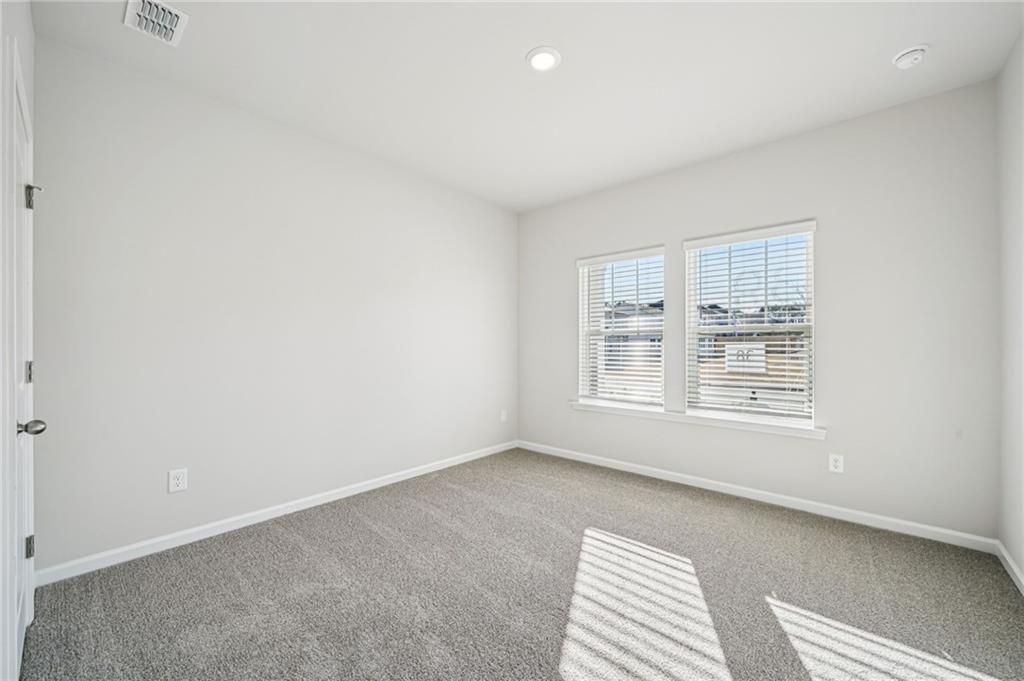 1428 High Fls Lane Grayson, GA 30017 - Photo 14 of 39 a view of an empty room with a window