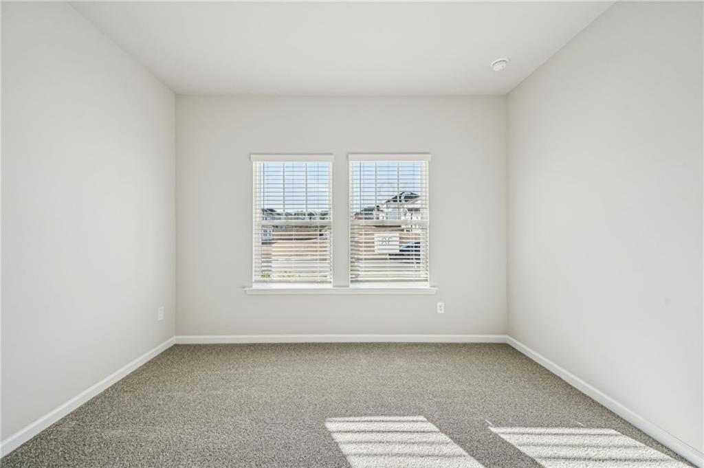 1428 High Fls Lane Grayson, GA 30017 - Photo 15 of 39 an empty room with a window