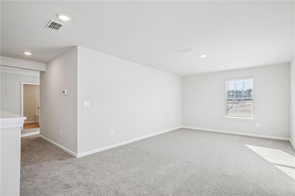 1428 High Fls Lane Grayson, GA 30017 - Photo 19 of 39 an empty room with a empty space and windows