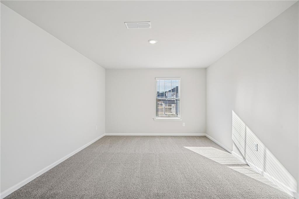 1428 High Fls Lane Grayson, GA 30017 - Photo 20 of 39 a view of an empty room with a window