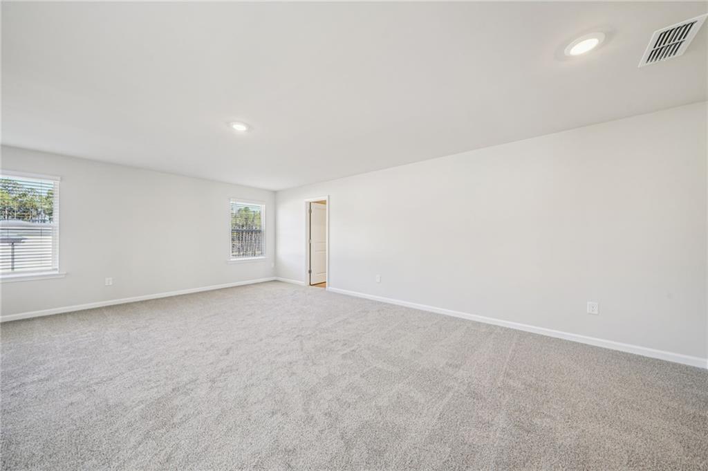 1428 High Fls Lane Grayson, GA 30017 - Photo 21 of 39 an empty room with windows