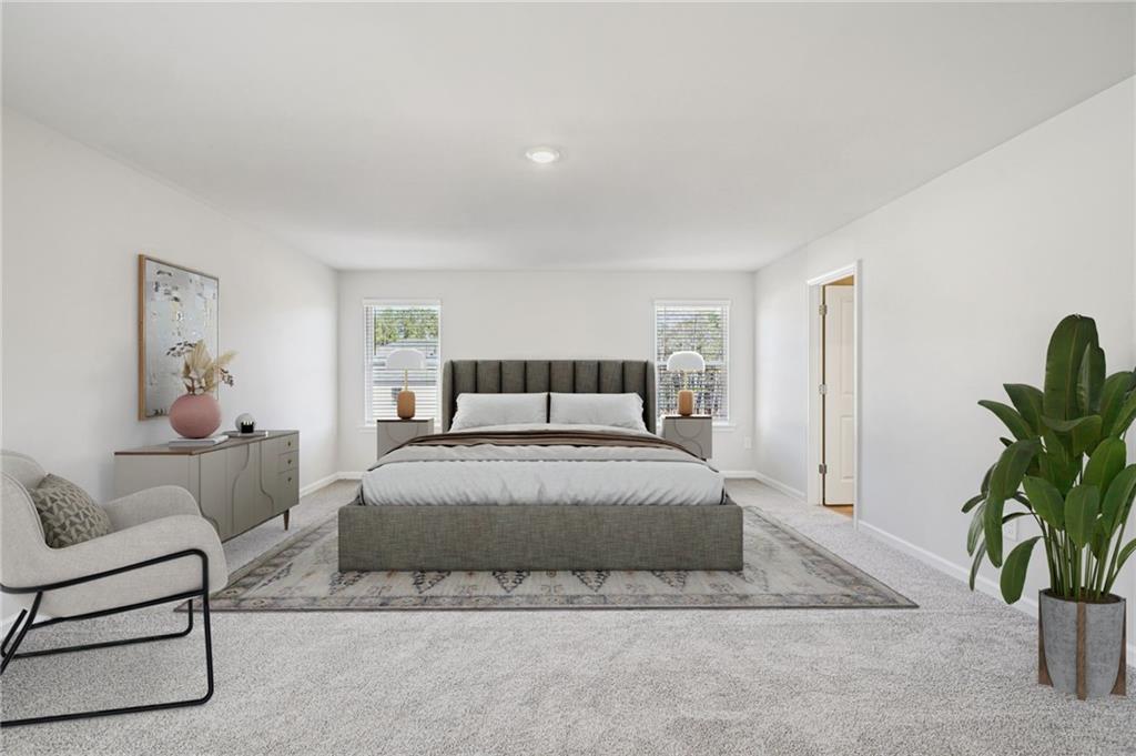 1428 High Fls Lane Grayson, GA 30017 - Photo 23 of 39 a bedroom with a bed and a couch