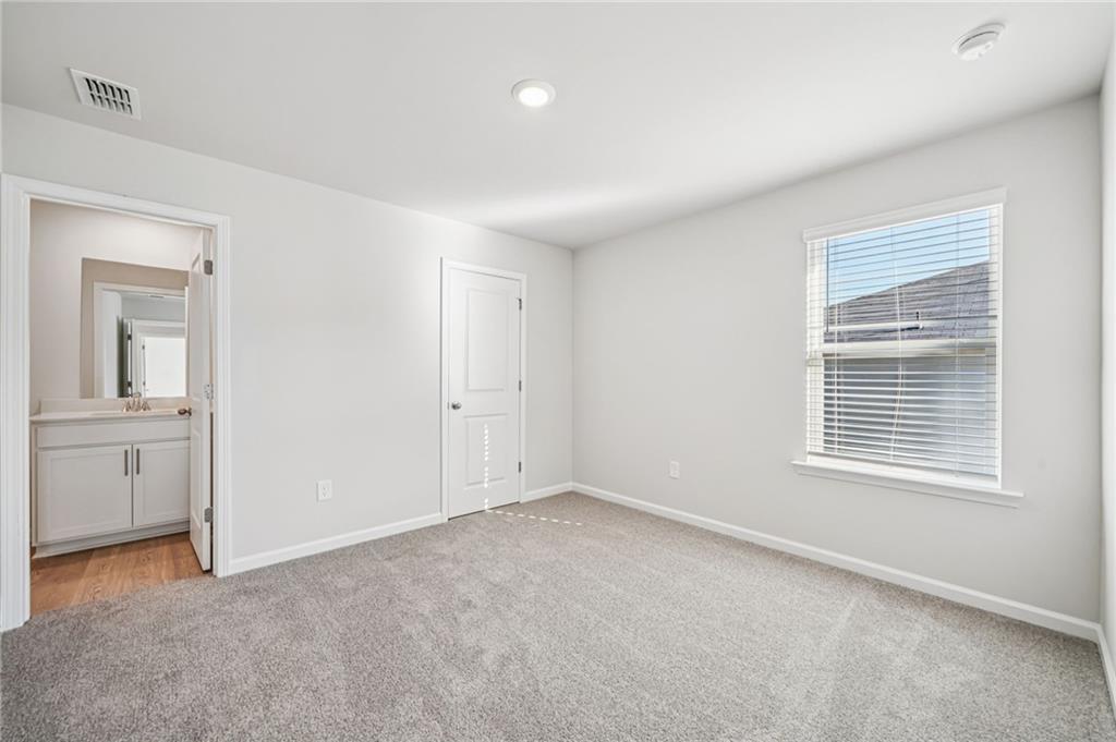 1428 High Fls Lane Grayson, GA 30017 - Photo 29 of 39 a view of an empty room with a window