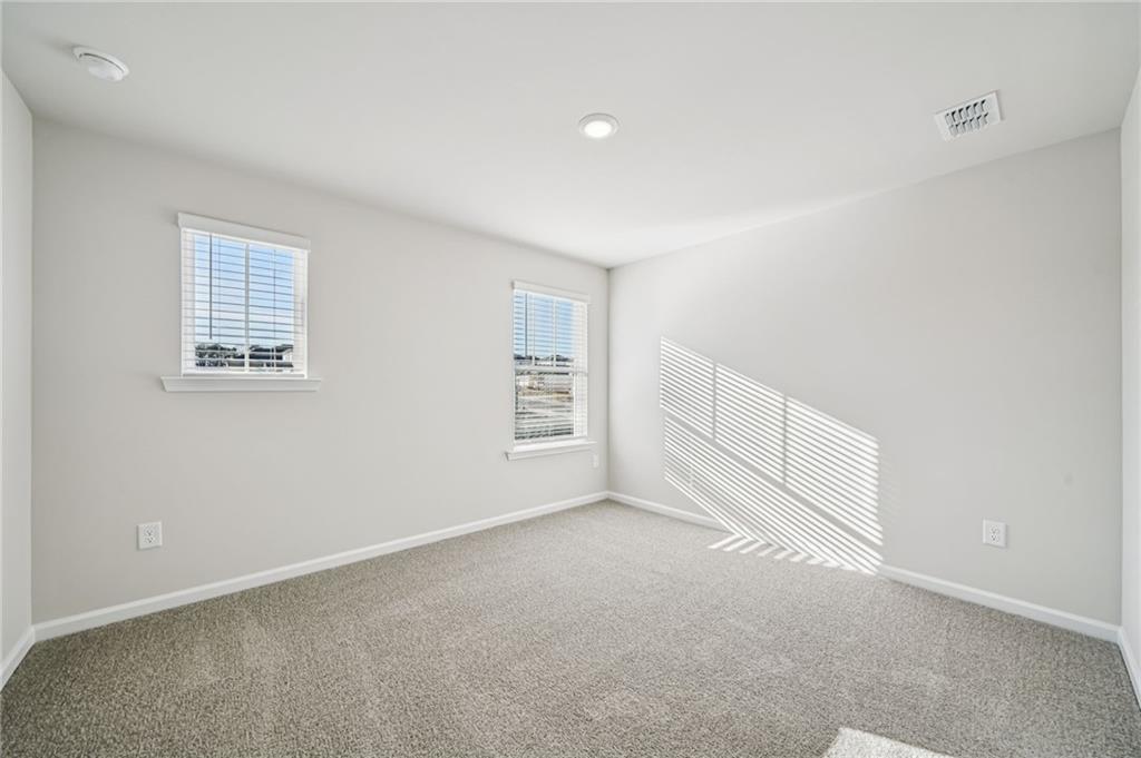 1428 High Fls Lane Grayson, GA 30017 - Photo 33 of 39 an empty room with windows