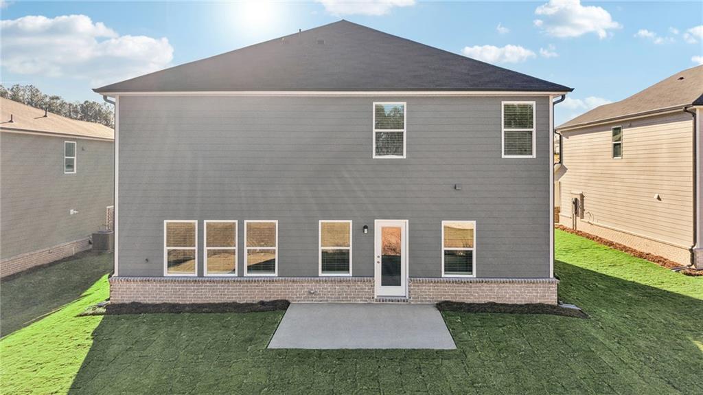 1428 High Fls Lane Grayson, GA 30017 - Photo 35 of 39 a front view of a house with a yard