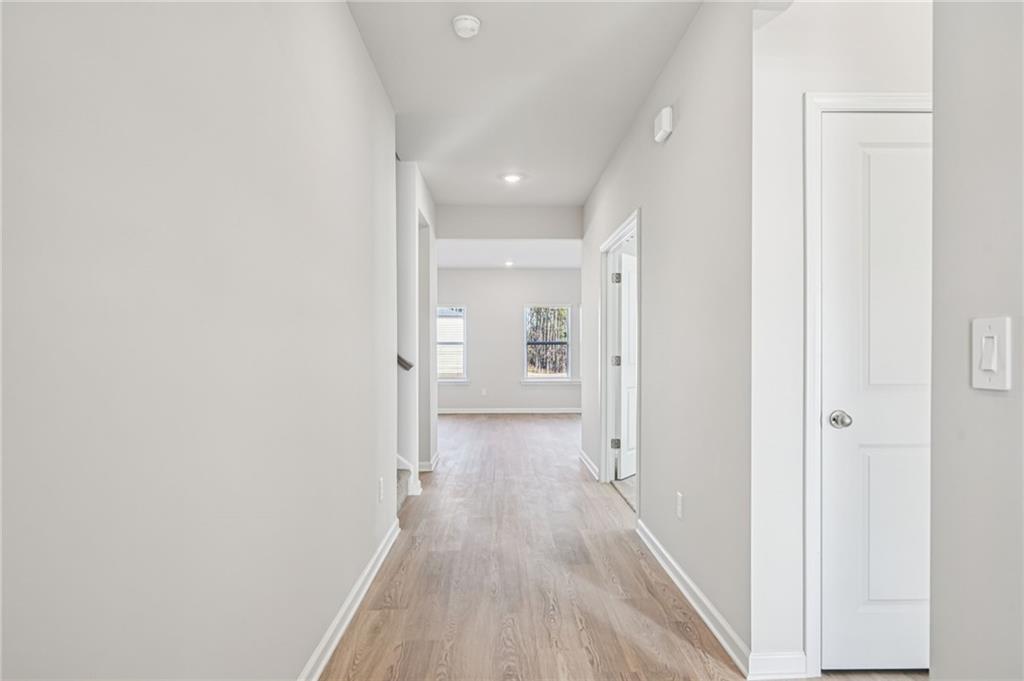 1428 High Fls Lane Grayson, GA 30017 - Photo 4 of 39 a view of a hallway with wooden floor