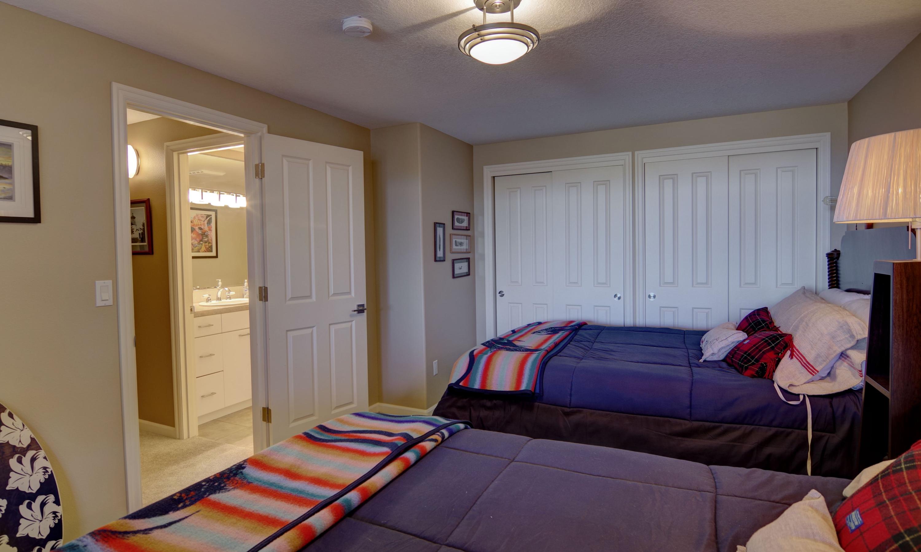 1065 Arthurs Road Oceanside, OR 97141 - Photo 39 of 47 a bedroom with a bed and window