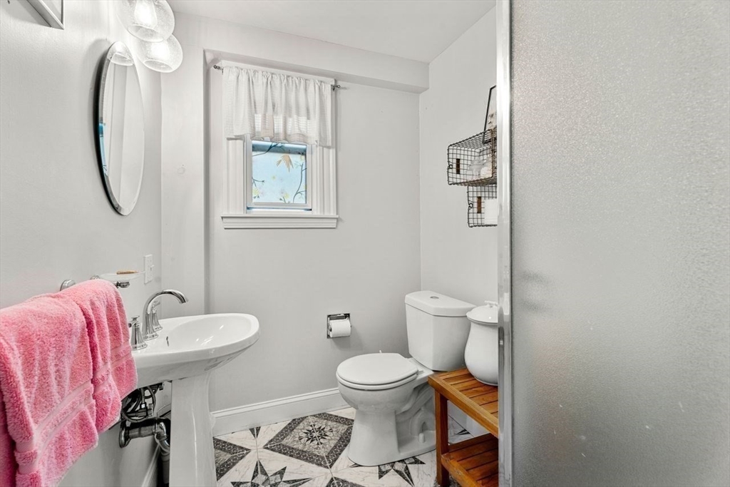 139 Jersey Street Marblehead, MA 01945 - Photo 24 of 42 a bathroom with a toilet a sink and a mirror