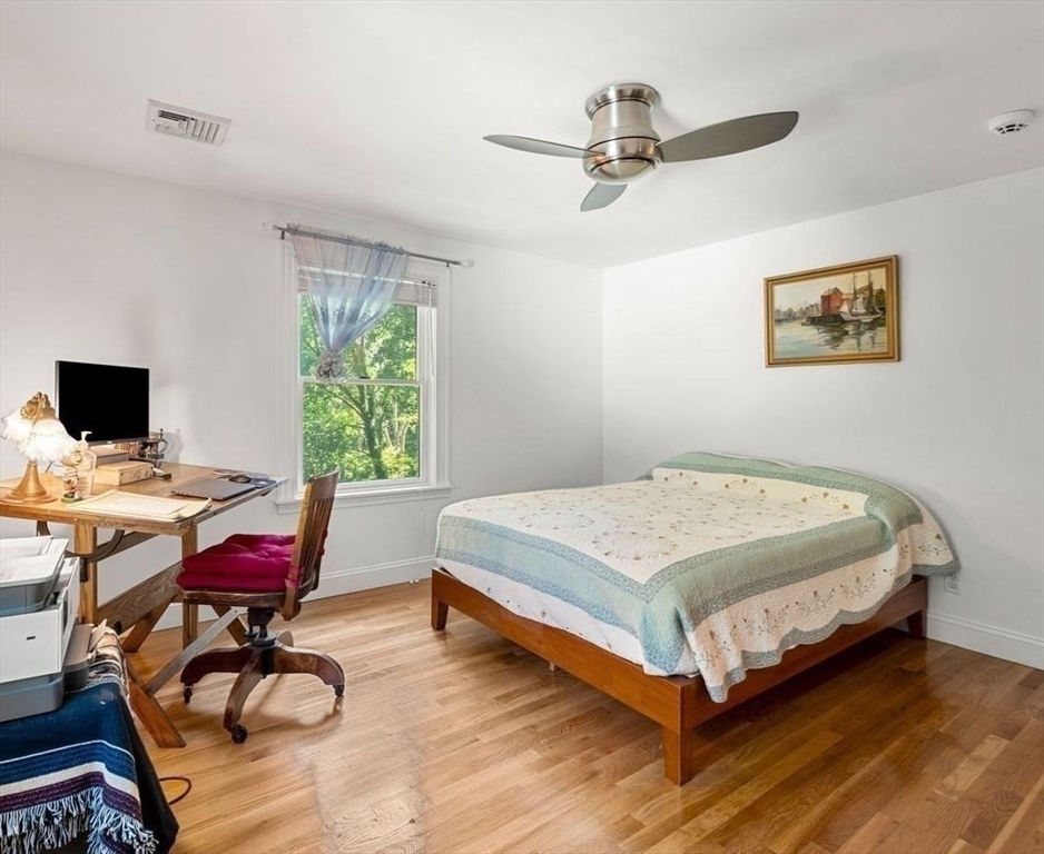 139 Jersey Street Marblehead, MA 01945 - Photo 31 of 42 a bedroom with a bed and a desk