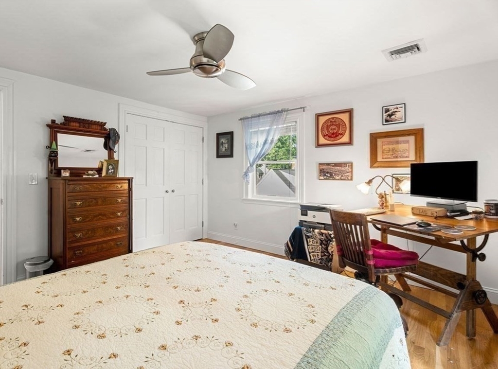 139 Jersey Street Marblehead, MA 01945 - Photo 32 of 42 a bedroom with a bed and a flat screen tv