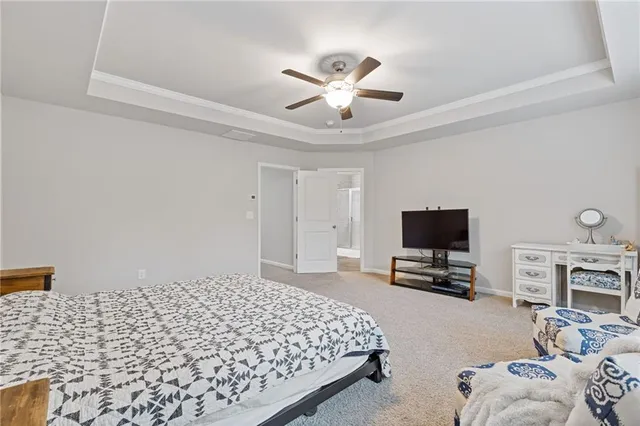 a view of walk in closet with clothes