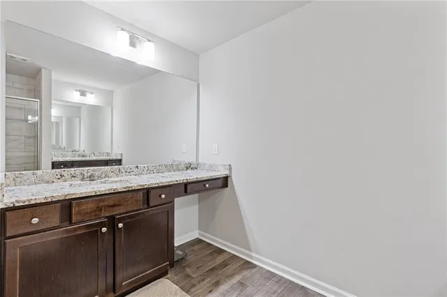 a bedroom with a bed and ceiling fan