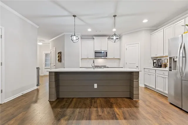 a view of kitchen island with furniture and wooden floor