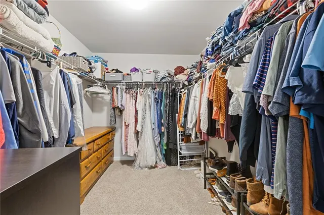 a view of a backyard with open kitchen