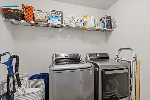 a view of a kitchen with wooden floor and electronic appliances