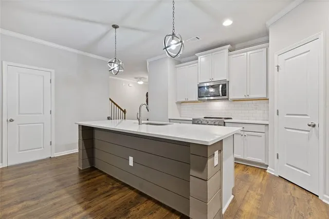 a bedroom with bed and a flat screen tv